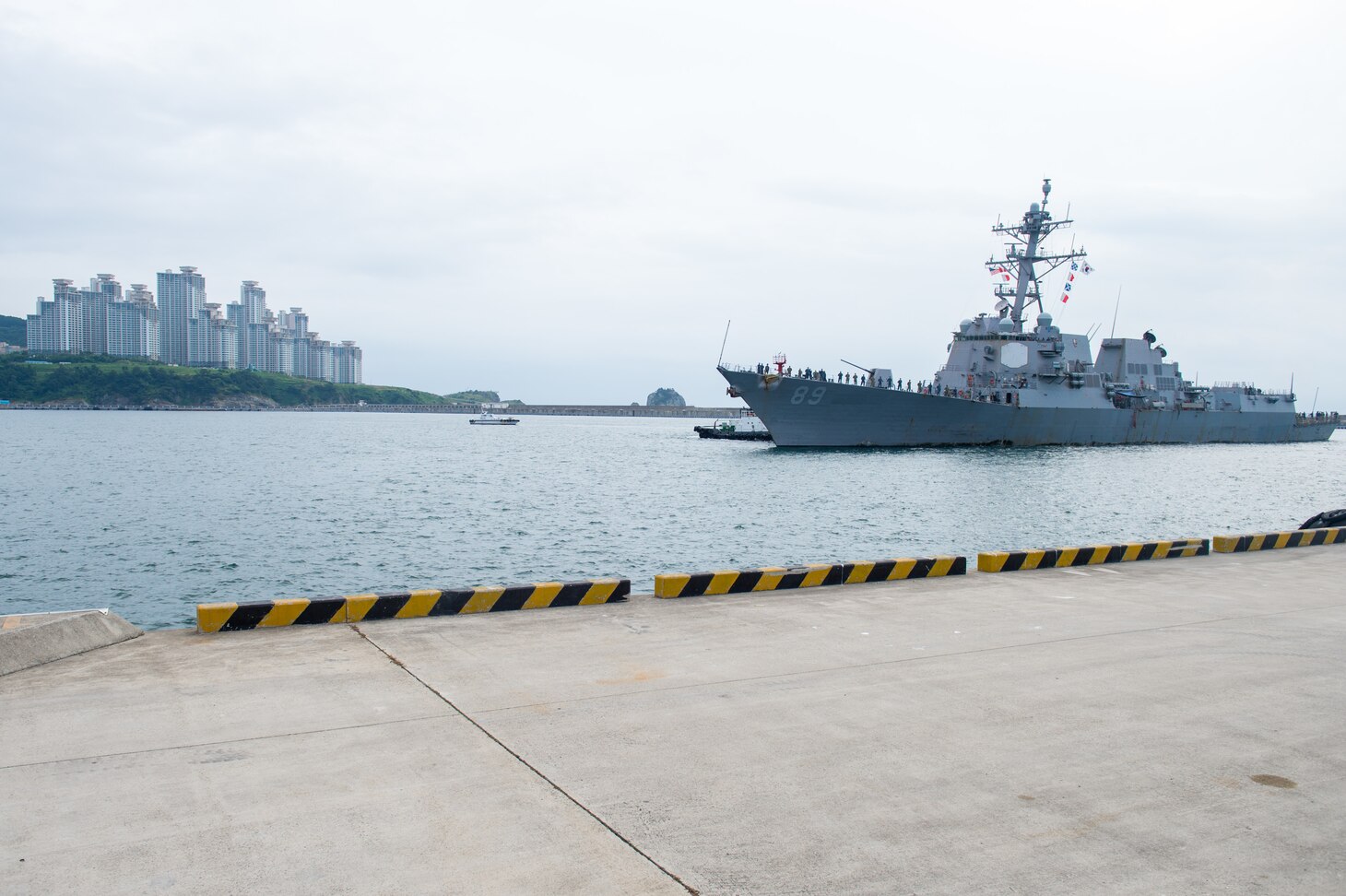 BUSAN, Republic of Korea (Aug. 12, 2018) The Arleigh Burke-class guided-missile destroyer USS Mustin (DDG 89) arrives at Republic of Korea Navy's Busan Navy Base for a port visit to avoid a storm in the region. Mustin is in the U.S. 7th Fleet area of responsibility supporting security and stability in the Indo-Asia-Pacific.