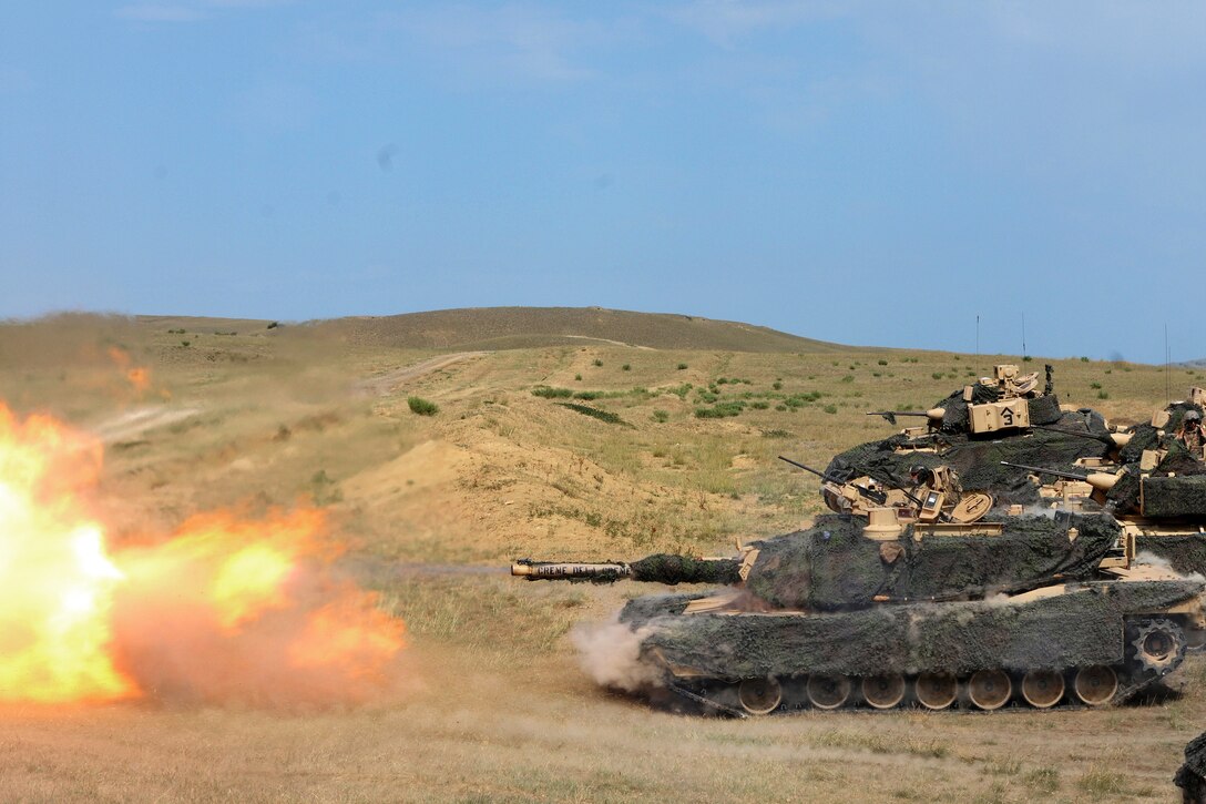 Soldiers fire the M1A2 Abrams tank main battle gun.