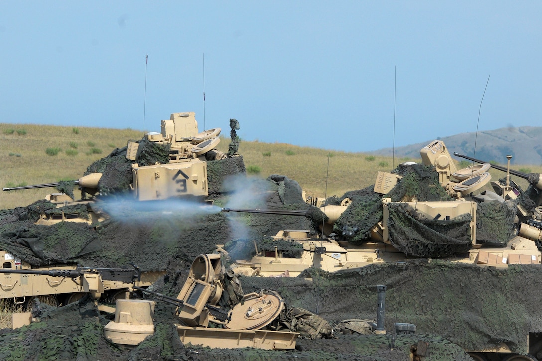 Soldiers fire the M2A3 Bradley fighting vehicle main gun during a live-fire.