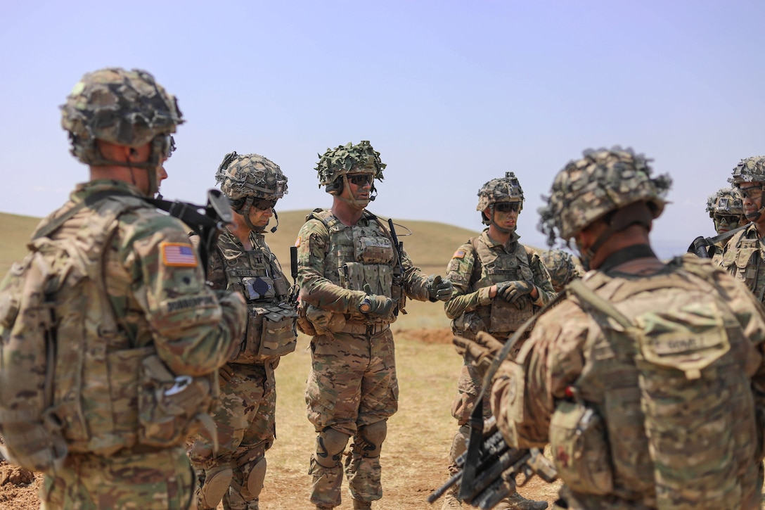 Soldiers conduct an after-action review.