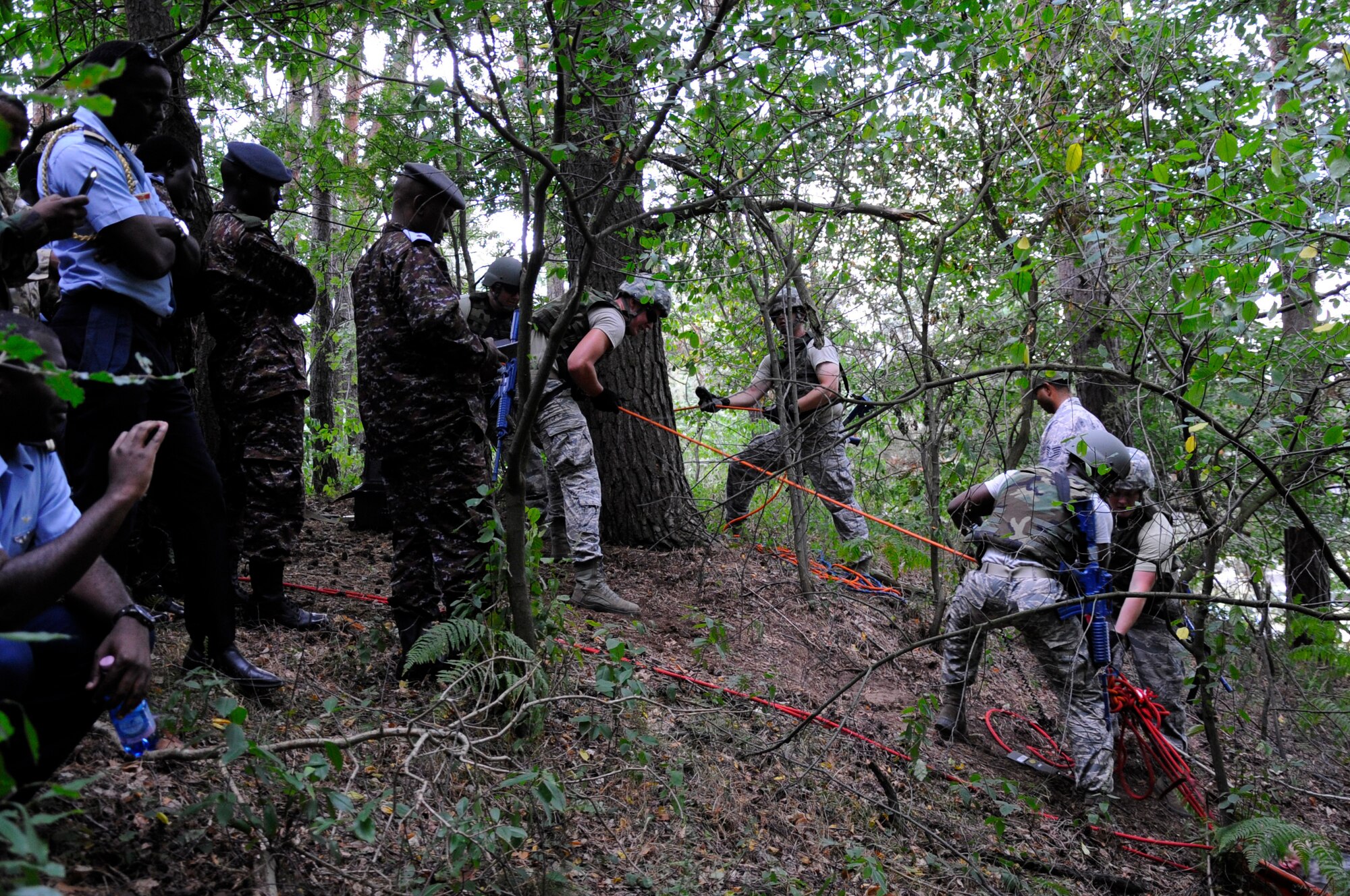 Participants from seven different African partner nations, observe U.S. Airmen assigned to 435th Construction and Training Squadron as they conduct causality recovery training during African Partnership Flight, hosted by U.S. Air Forces Africa and co-hosted by Mauritania and Senegal at Ramstein Air Base, Germany, Aug. 9, 2018. The APF program is Air Forces in Africa's premier security cooperation program with African partner nations to improve professional military aviation knowledge and skills. (U.S. Army photo by Spc. Craig Jensen)
