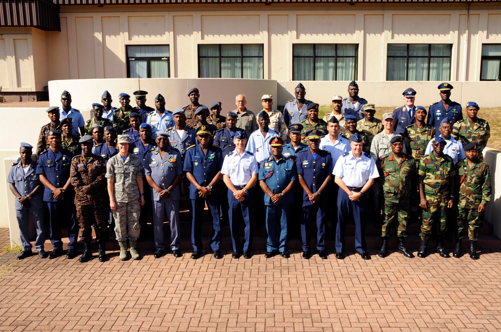 Participants from seven different African partner nations and U.S. Service Members, pose for a photo during African Partnership Flight, hosted by U.S. Air Forces Africa and co-hosted by Mauritania and Senegal at Ramstein Air Base, Germany, Aug. 9, 2018. The APF program is Air Forces in Africa's premier security cooperation program with African partner nations to improve professional military aviation knowledge and skills. (U.S. Army photo by Spc. Craig Jensen)