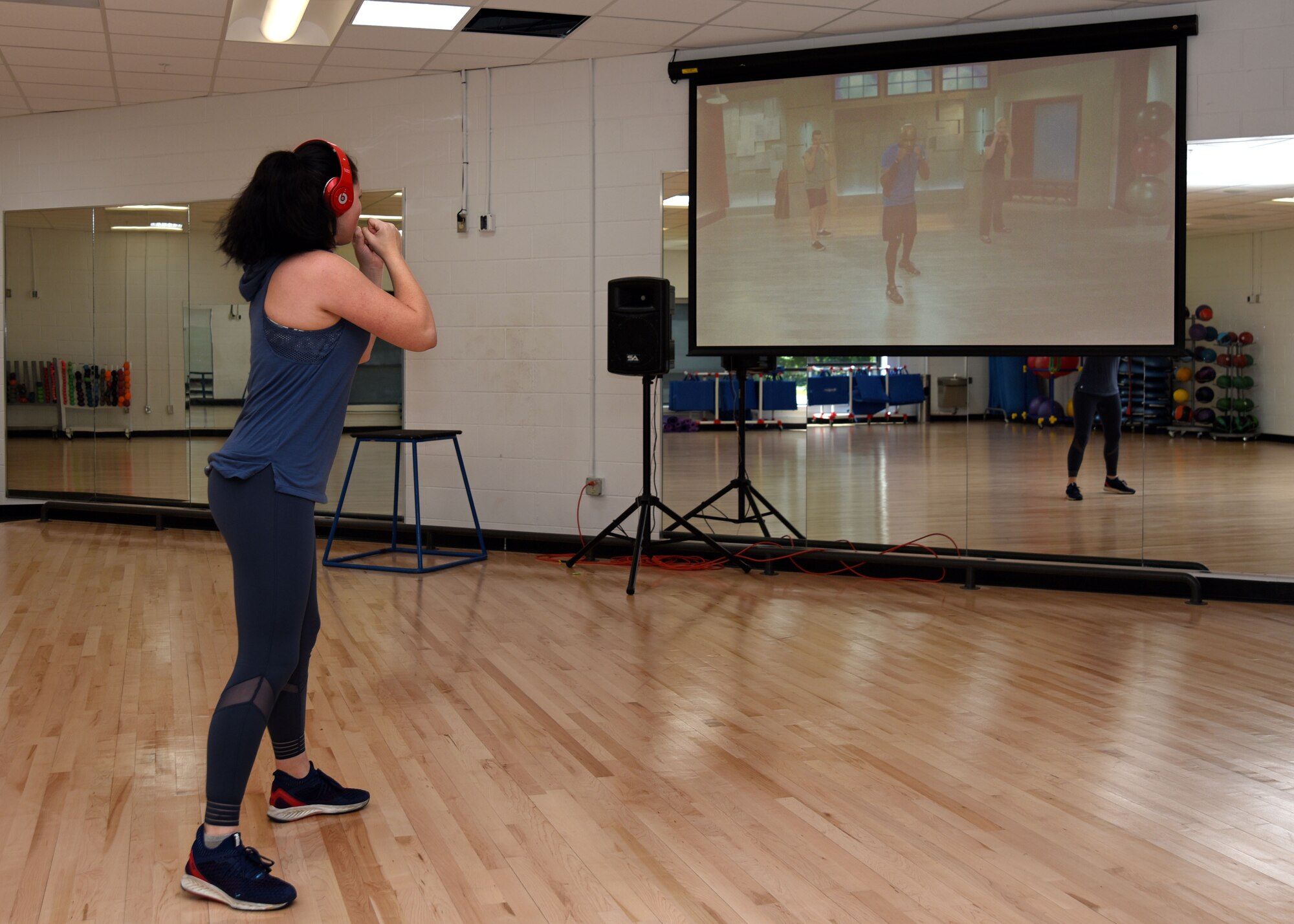 U.S. Air Force Airman 1st Class BrieAnna Stillman, 20th Fighter Wing public affairs office photojournalist journeyman, follows along with a kickboxing video at the 20th Force Support Squadron main fitness center at Shaw Air Force Base, S.C., Aug. 10, 2018.