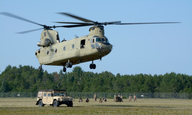 Soldiers of the 2-135th General Support Aviation Battalion perform sling-load lifts during Northern Strike 18, at Alpena Combat Readiness Training Center, Alpena, Mich, Aug 11, 2018.