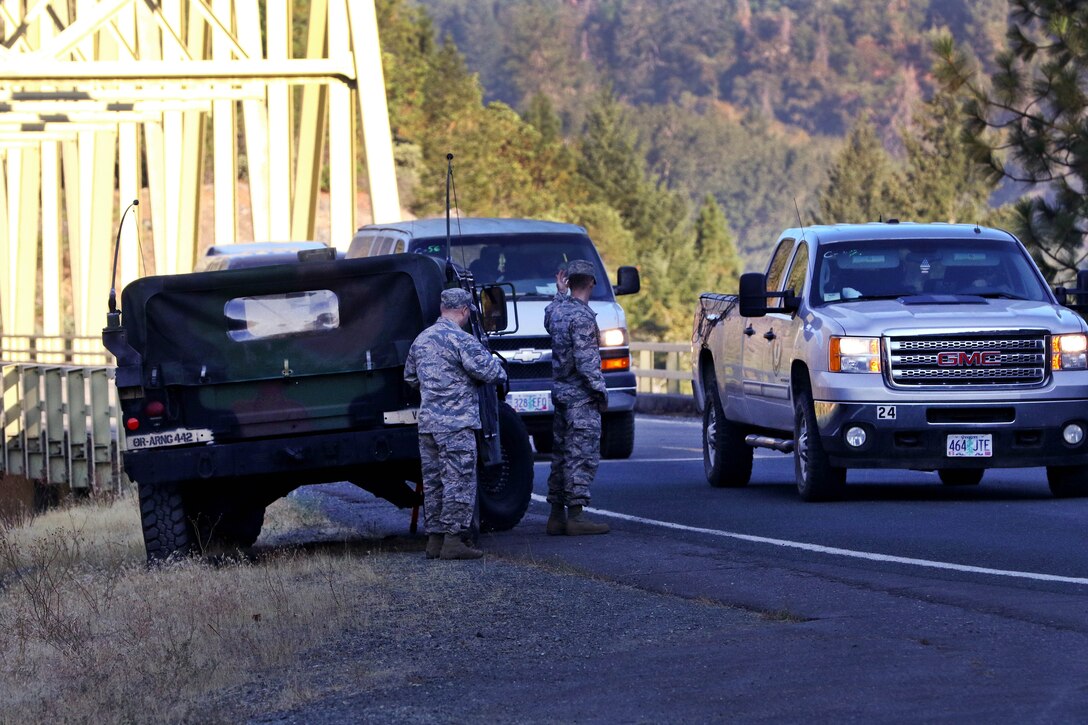 Oregon Air and Army National Guardsmen help a lost driver.