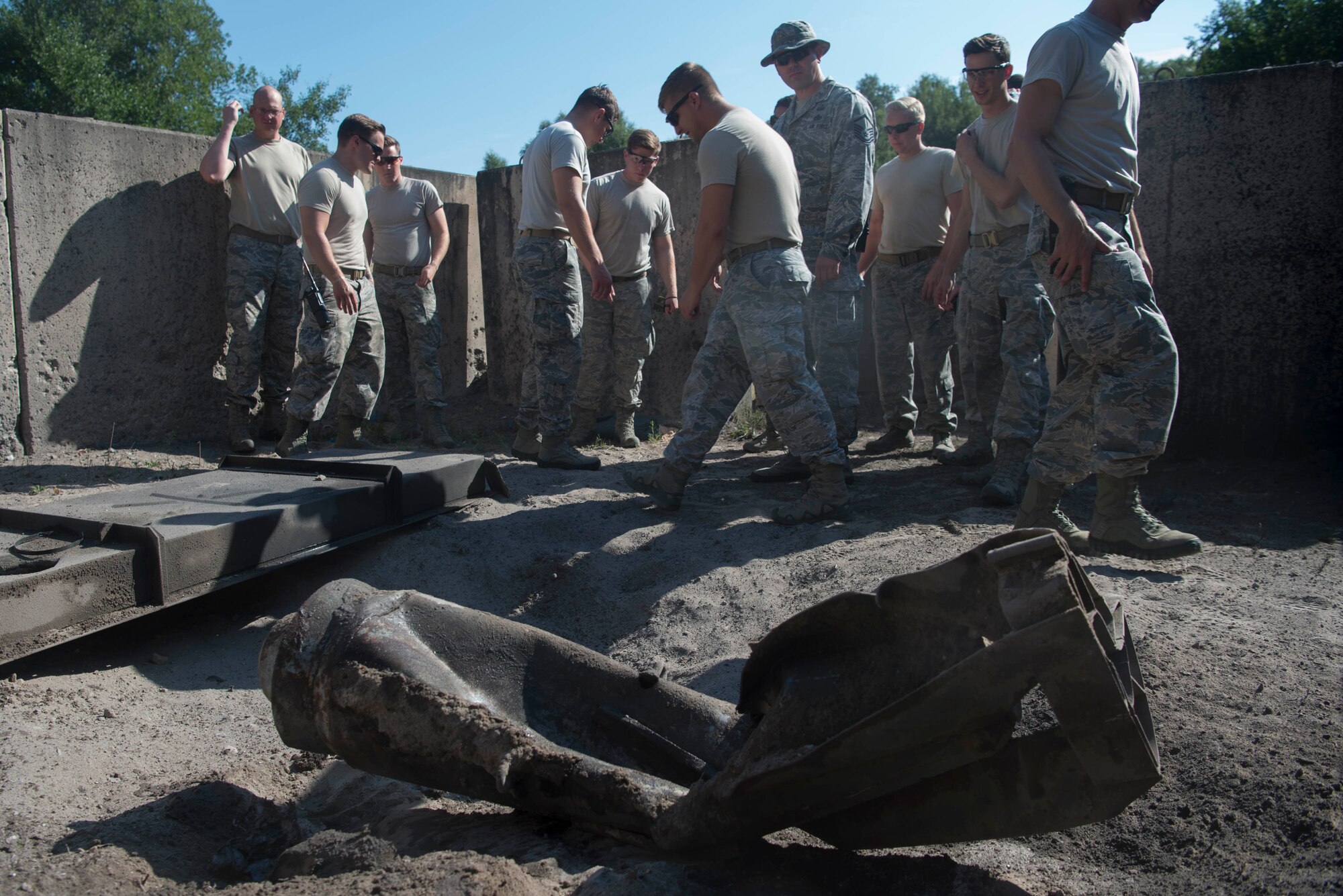 The 786th Civil Engineer Squadron Explosive Ordinance Disposal Airmen observe the effects of explosive detonation charges on Ramstein Air Base, Germany, July 31, 2018. EOD members apply classified techniques and special procedures to lessen or remove the hazards created by the presence of unexploded ordnance. (U.S. Air Force photo by Senior Airman Elizabeth Baker)