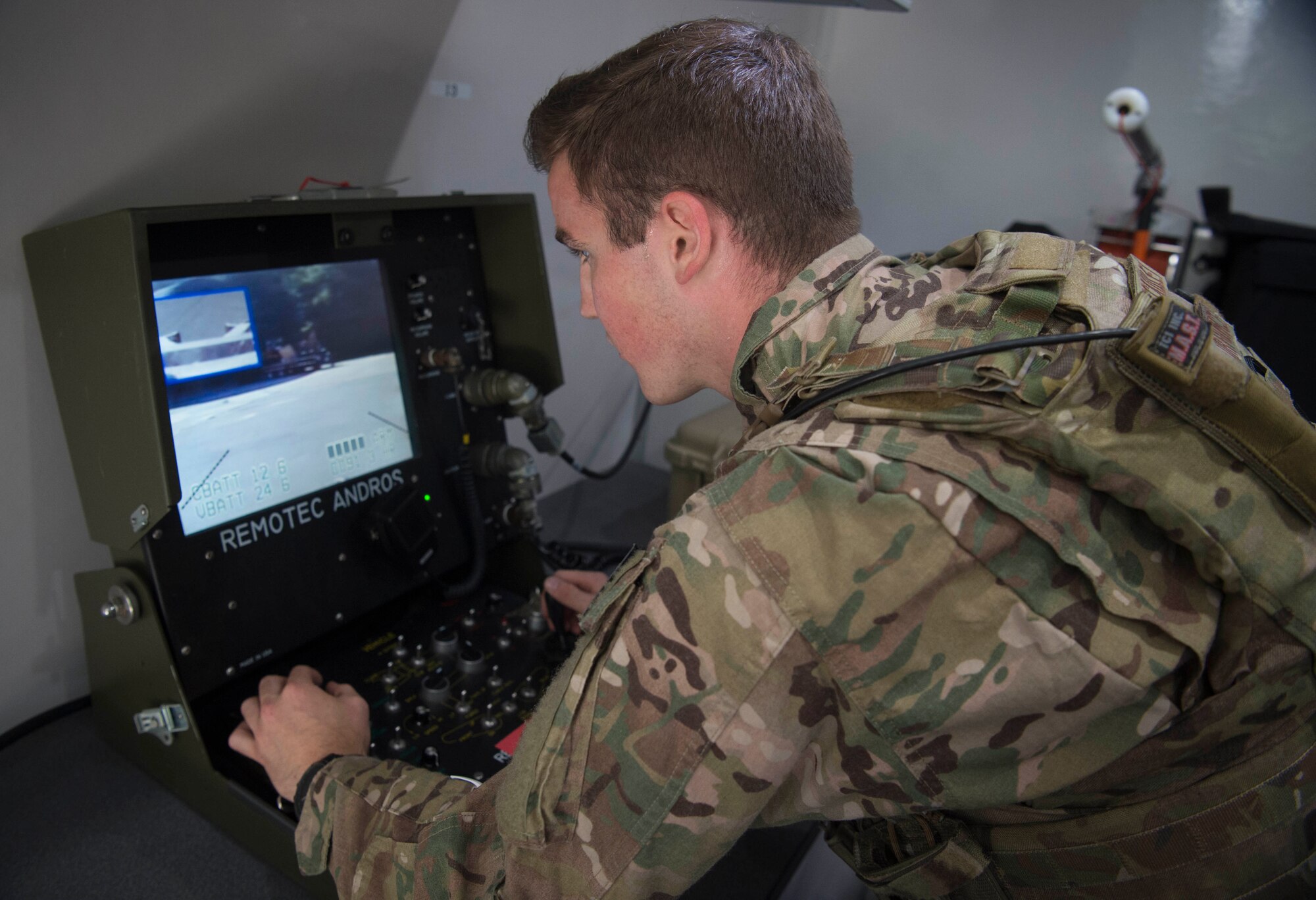 U.S. Air Force Senior Airman Jonathon McCauley, 786th Civil Engineer Squadron Explosive Ordinance Disposal technician, operates an F6A reconnaissance robot on Ramstein Air Base, Germany, Aug. 2, 2018. To become EOD technicians, Airmen attend a course designed to be physically and mentally grueling at Eglin Air Force Base, Florida, where they learn the principles behind recognizing, disarming and neutralizing explosive materials. (U.S. Air Force photo by Senior Airman Elizabeth Baker)