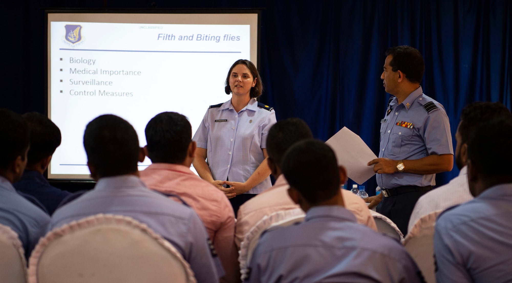 U.S. Air Force Maj. Vicki Charbonneau, 15th Aerospace Medicine Squadron public health officer, briefs a group of civilian public health officials, entomologists, Sri Lankan military doctors, and military public health officials about the importance of capturing insects during an exchange for Pacific Angel (PAC ANGEL) 18-4, in Anuradhapura, Sri Lanka, Aug. 9, 2018. PAC ANGEL 18 fosters partnerships though multilateral humanitarian assistance and civil military operations, which promote regional cooperation and interoperability. (U.S. Air Force photo by Tech. Sgt. Heather Redman)