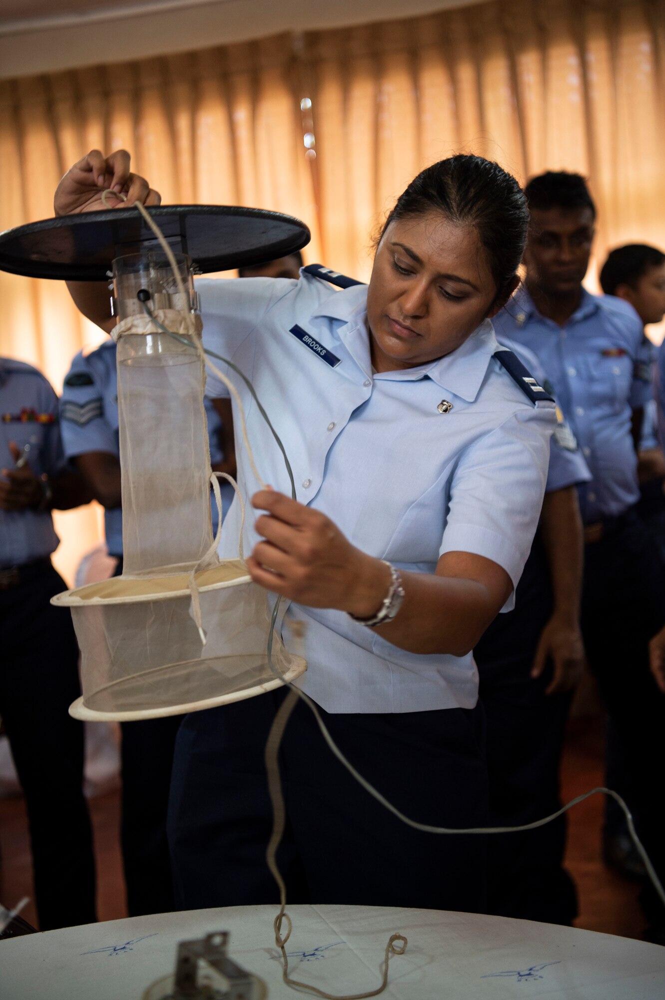 U.S. Air Force Capt. Caroline Brooks, 18th Aerospace Medicine Squadron medical entomologist, builds a mosquito trap during an exchange for Pacific Angel (PAC ANGEL) 18-4, in Anuradhapura, Sri Lanka, Aug. 9, 2018. PAC ANGEL 18 fosters partnerships though multilateral humanitarian assistance and civil military operations, which promote regional cooperation and interoperability. (U.S. Air Force photo by Tech. Sgt. Heather Redman)