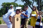 U.S. Navy Rear Adm. John Spencer's sons remove his old combination cover during his promotion ceremony on the missile deck at U.S. Strategic Command (USSTRATCOM) headquarters on Offutt Air Force Base, Neb., Aug. 9, 2018. Spencer is the executive assistant to U.S. Air Force Gen. John Hyten, commander of USSTRATCOM. His next assignment will be the director of Nuclear Support Directorate, Defense Threat Reduction Agency at Ft. Belvoir, Va.  USSTRATCOM has global responsibilities assigned through the Unified Command Plan that include strategic deterrence, nuclear operations, space operations, joint electromagnetic spectrum operations, global strike, missile defense, and analysis and targeting. (U.S. Navy photo by Mass Communication Specialist 1st Class Julie R. Matyascik/Released)