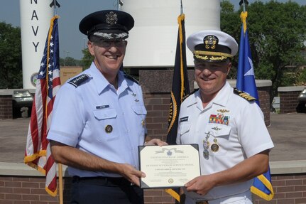 U.S. Air Force Gen. John E. Hyten, commander of U.S. Strategic Command (USSTRATCOM), reaffirms the oath of office to U.S. Navy Rear Adm. John Spencer during his promotion ceremony on the missile deck at USSTRATCOM headquarters on Offutt Air Force Base, Neb., Aug. 9, 2018. Spencer is the executive assistant to Gen. Hyten. His next assignment will be the director of Nuclear Support Directorate, Defense Threat Reduction Agency at Ft. Belvoir, Va.  USSTRATCOM has global responsibilities assigned through the Unified Command Plan that include strategic deterrence, nuclear operations, space operations, joint electromagnetic spectrum operations, global strike, missile defense, and analysis and targeting.