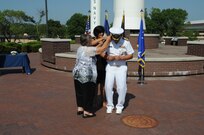 U.S. Navy Rear Adm. John Spencer's wife and his mother pin shoulder boards during his promotion ceremony on the missile deck at U.S. Strategic Command (USSTRATCOM) headquarters on Offutt Air Force Base, Neb., Aug. 9, 2018. Spencer is the executive assistant to U.S. Air Force Gen. John Hyten, commander of USSTRATCOM. His next assignment will be the director of Nuclear Support Directorate, Defense Threat Reduction Agency at Ft. Belvoir, Va.  USSTRATCOM has global responsibilities assigned through the Unified Command Plan that include strategic deterrence, nuclear operations, space operations, joint electromagnetic spectrum operations, global strike, missile defense, and analysis and targeting.