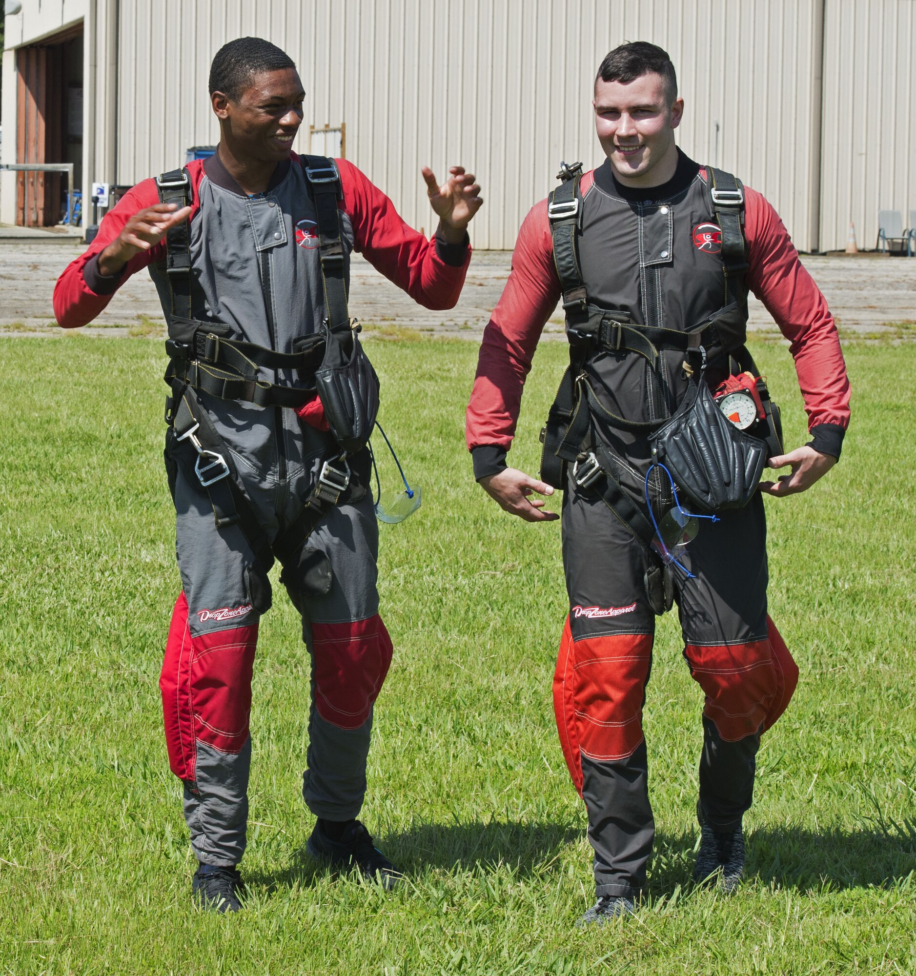 U.S. Air Force Airman 1st Class Gabriel Ford, left, and Airman 1st Class Tyler Sims, 20th Equipment Maintenance Squadron stock pile management crew chiefs, discuss their experiences following a “leap of faith” skydiving event in Chester, S.C., Aug. 11, 2018.