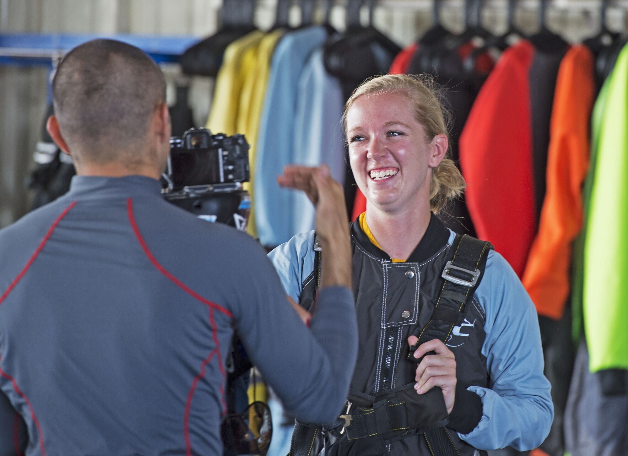 U.S. Airman 1st Class Elizabeth Coleman, 20th Equipment Maintenance Squadron munition systems specialist smiles during an on-camera interview before going skydiving in Chester, S.C., Aug. 11, 2018.