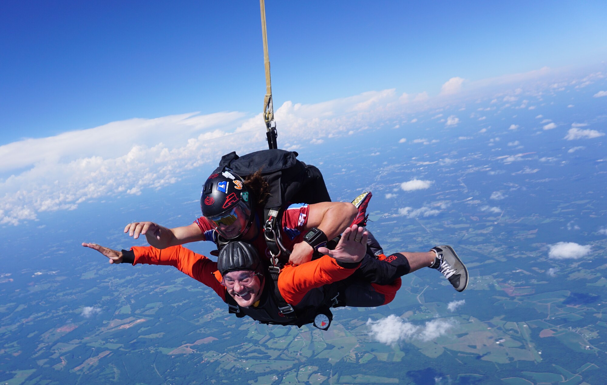 U.S. Air Force Chaplain (Capt.) James Finley, 20th Fighter Wing chaplain, smiles at the camera as he falls from 15,000 feet Chester, S.C., Aug. 11, 2018.