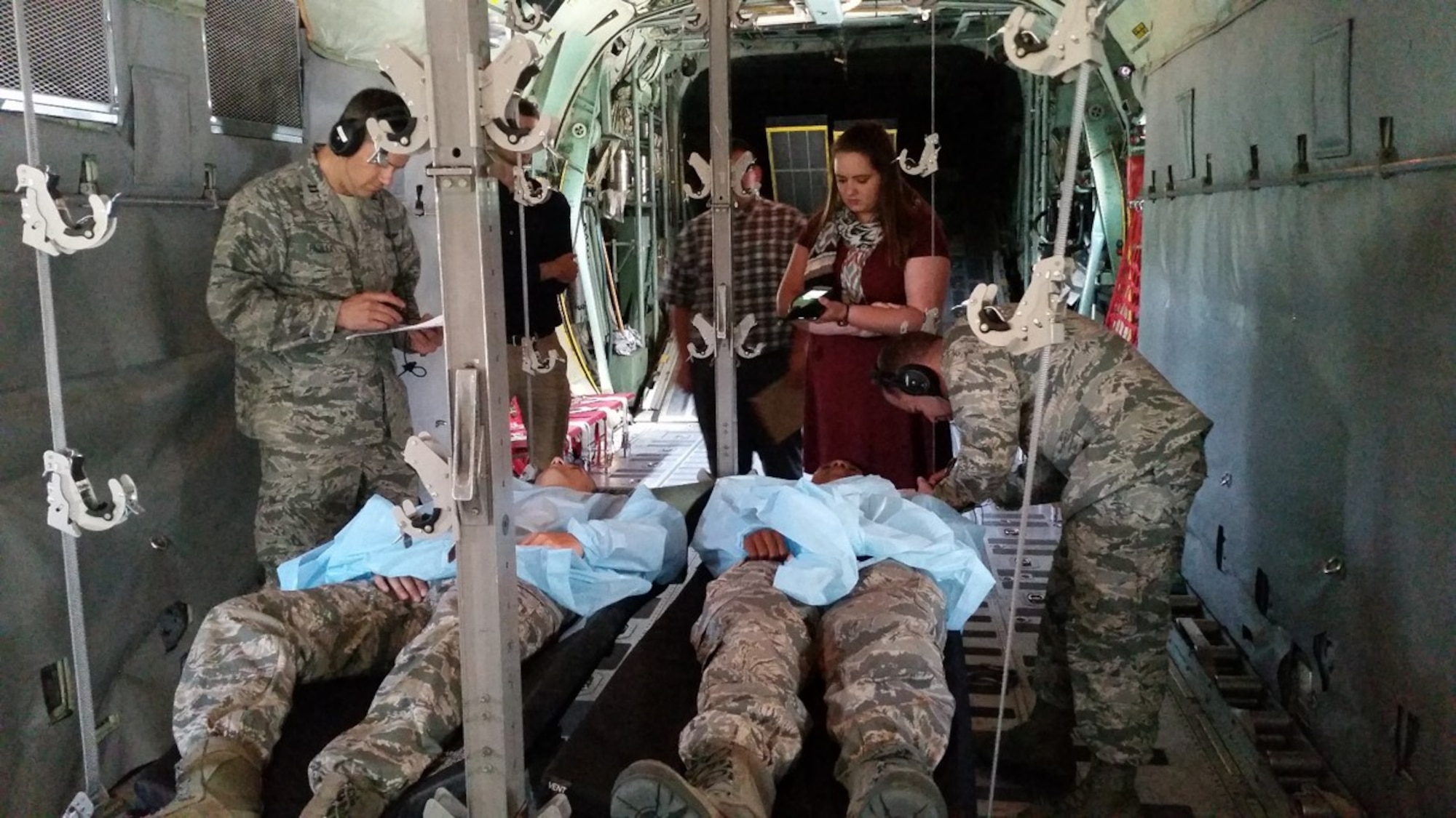 Researchers with the 711th Human Performance Wing at Wright-Patterson Air Force Base, Ohio, evaluate the noise-immune stethoscope on mock patients, Sept. 15, 2016. Prior to noise-immune stethoscope technologies, traditional stethoscope would not function properly due to the dynamic, high-noise environment of an aircraft. (Courtesy photo)