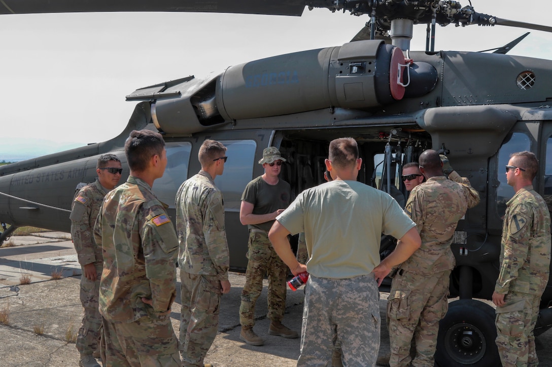 An Army helicopter pilot conducts helicopter orientation for soldiers.