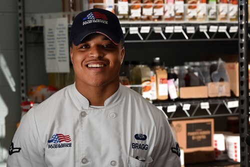 U.S. Air Force Airman Arkarris Bragg, 20th Force Support Squadron food services apprentice, stands in the Chief Master Sgt. Emerson E. Williams dining facility at Shaw Air Force Base, S.C., Aug. 9, 2018.