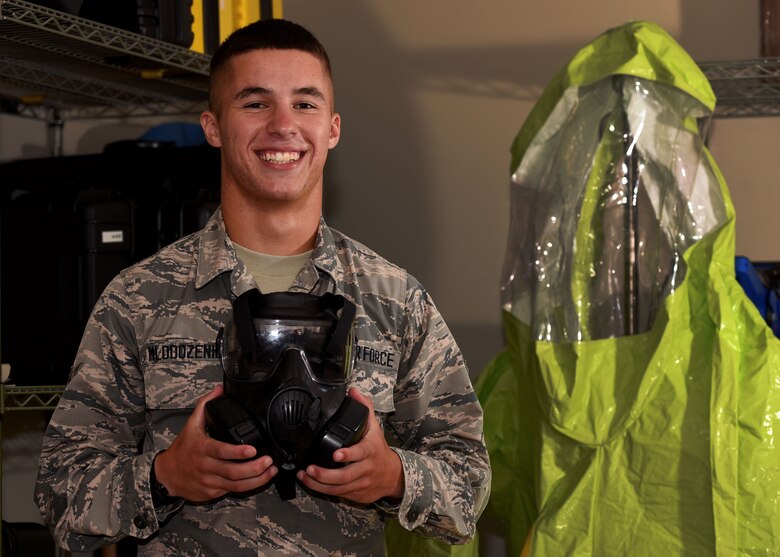 U.S. Air Force Airman Jacob Mlodozeniec, 20th Aerospace Medicine Squadron bioenvironmental engineer apprentice, holds a gas mask at Shaw Air Force Base, S.C., Aug. 10, 2018.