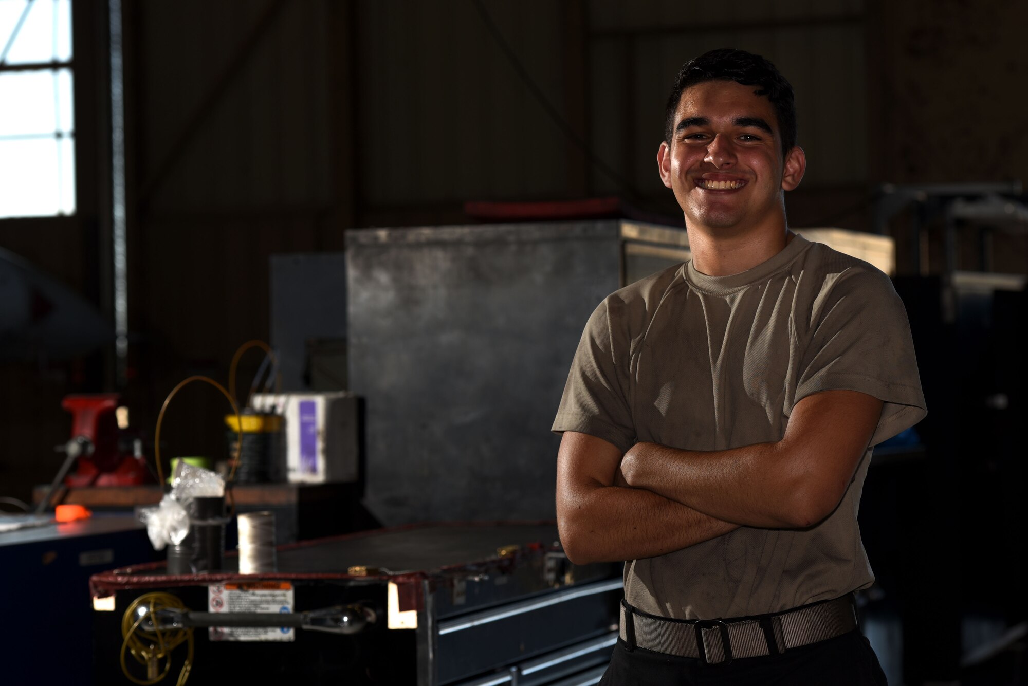 U.S. Air Force Airman 1st Class Jimmy Knutson, 20th Equipment Maintenance Squadron tactical aircraft maintainer, stands next to toolboxes in his work center at Shaw Air Force Base, S.C., Aug. 10, 2018.