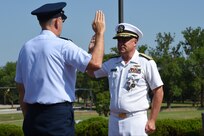 U.S. Air Force Gen. John E. Hyten, commander of U.S. Strategic Command (USSTRATCOM), reaffirms the oath of office to U.S. Navy Rear Adm. John Spencer during his promotion ceremony on the missile deck at USSTRATCOM headquarters on Offutt Air Force Base, Neb., Aug. 9, 2018. Spencer is the executive assistant to Gen. Hyten. His next assignment will be the director of Nuclear Support Directorate, Defense Threat Reduction Agency at Ft. Belvoir, Va.  USSTRATCOM has global responsibilities assigned through the Unified Command Plan that include strategic deterrence, nuclear operations, space operations, joint electromagnetic spectrum operations, global strike, missile defense, and analysis and targeting.