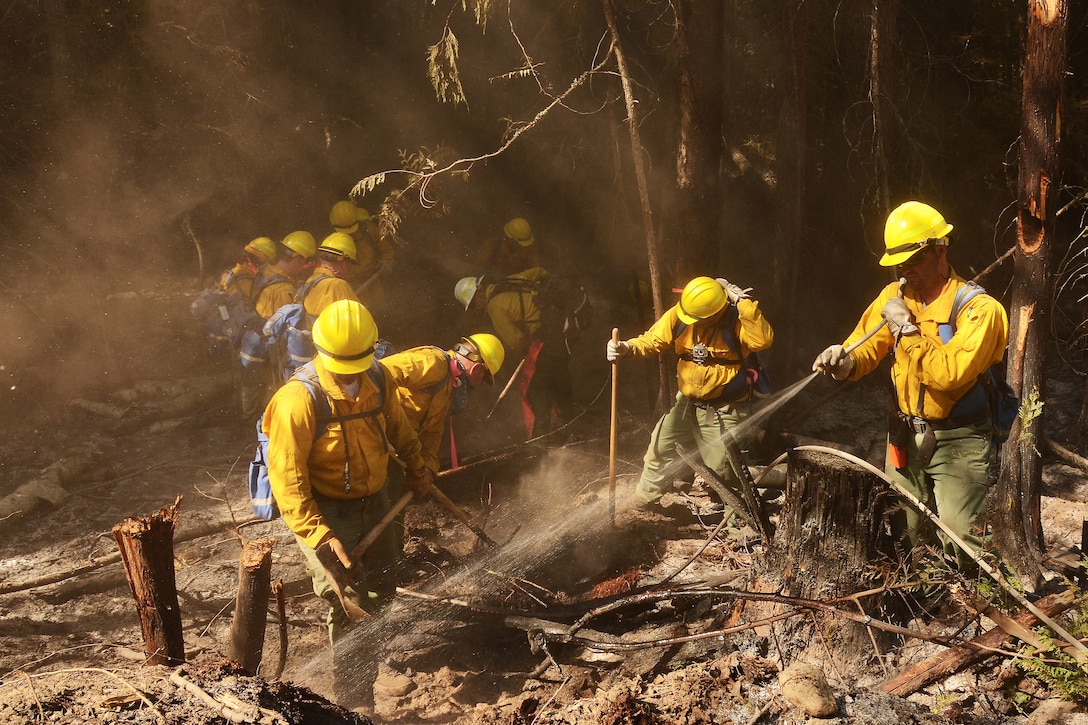 Air National Guard airmen fight a wildfire.