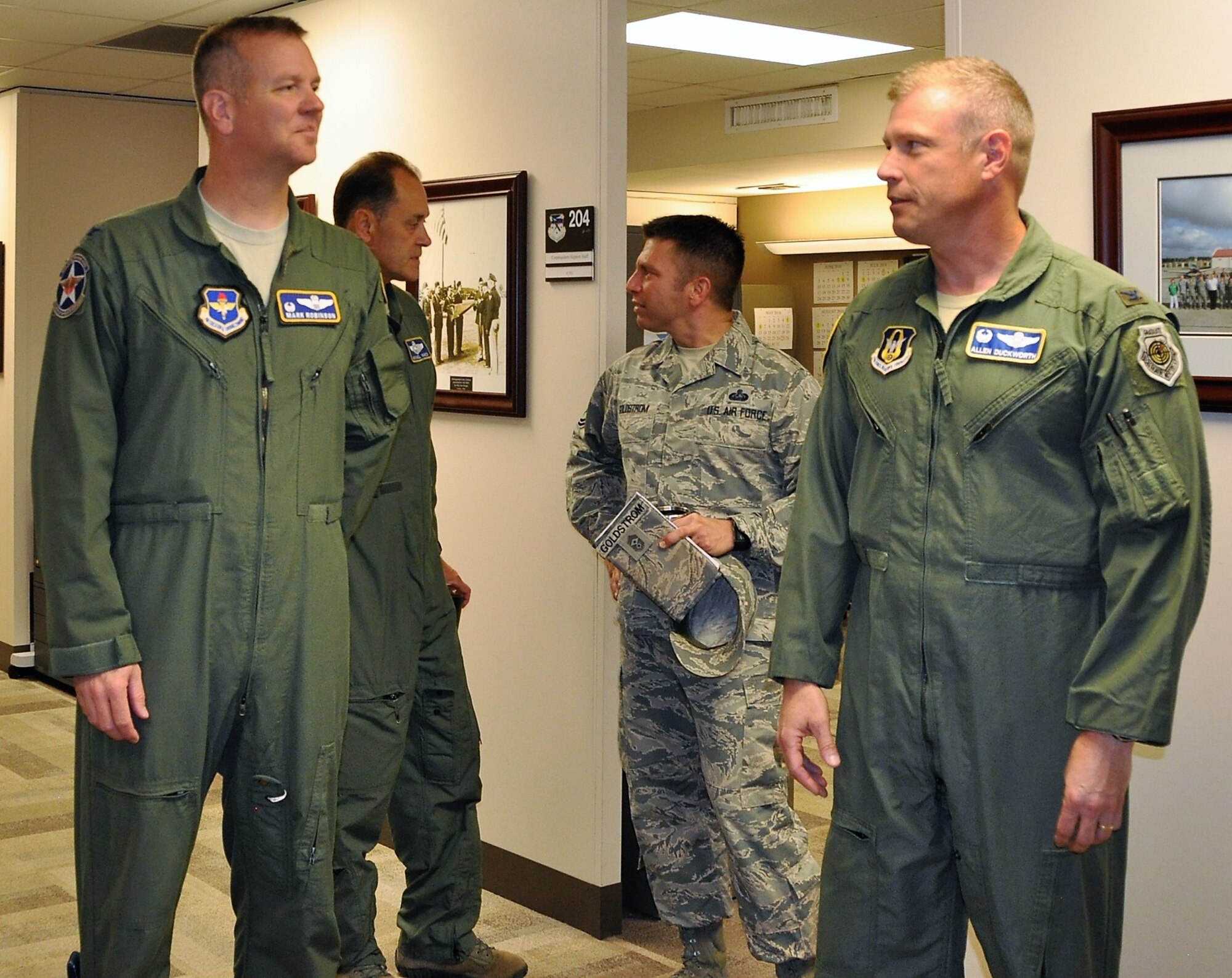 340th FTG Commander Col. Allen Duckworth (right) leads 12th FTW Commander, Col. Mark Robinson (left), Col. Michael Vanzo and Chief Master Sgt. Antonio Goldstrom, 12th FTW Command Chief on a tour of the 340th FTG headquarters at Joint Base San Antonio-Randolph, Texas during Robinson’s visit to the unit for an immersion brief on Aug. 9. (U.S. Air Force photo by Janis El Shabazz)