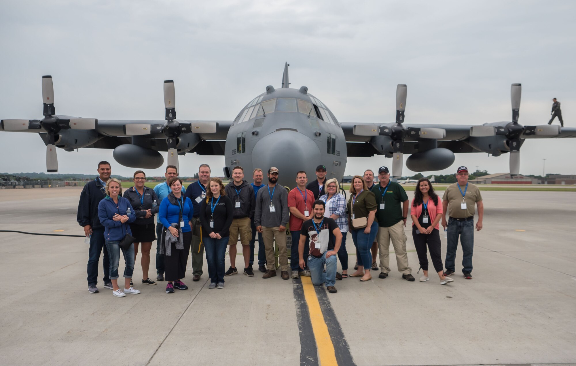 Employers pose in front of the C-130 they would fly on during Employers Day Aug. 4. (Air Force Photo/Paul Zadach)