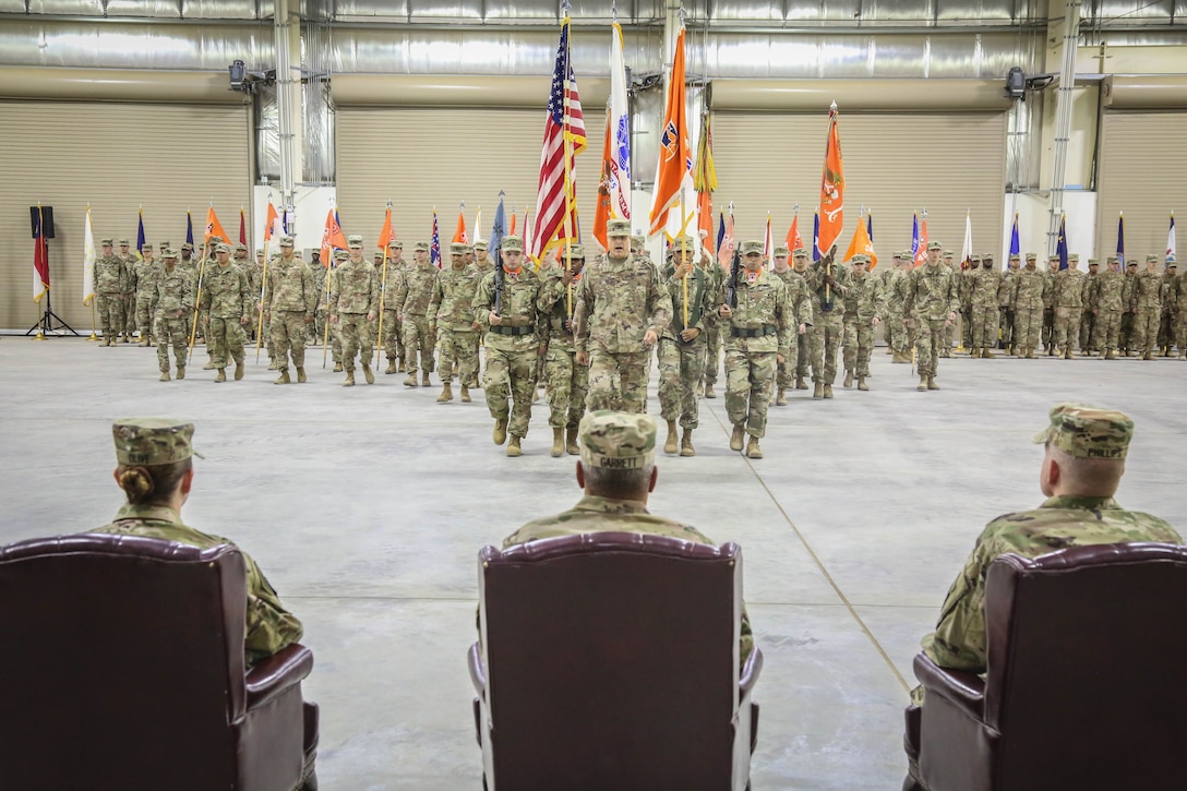 The official party observes the command during the 335th Signal Command (Theater) (Provisional) change of command ceremony between Brig. Gen. John H. Phillips and Brig. Gen. Nikki L. Griffin Olive. (U.S. Army photo by Staff Sgt. Timothy Villareal)