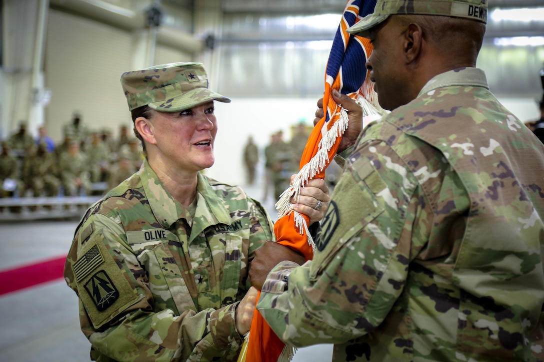 The official party observes the command during the 335th Signal Command (Theater) (Provisional) change of command ceremony between Brig. Gen. John H. Phillips and Brig. Gen. Nikki L. Griffin Olive. (U.S. Army photo by Staff Sgt. Timothy Villareal)