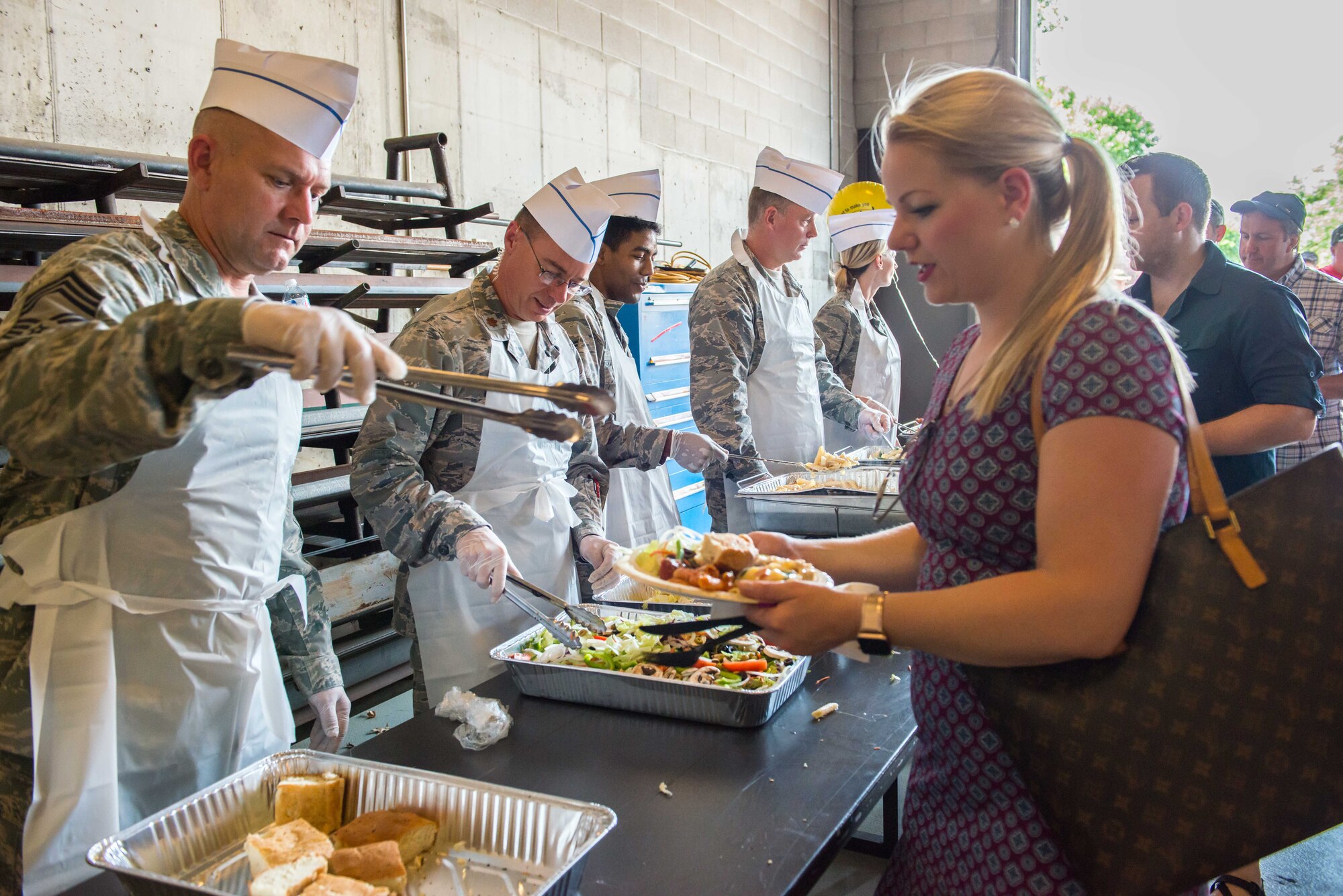 Commanders serve up a picnic lunch during the 934th Airlift Wing Family Day Aug. 5. (Air Force Photo/Tech. Sgt. Amber E.N. Jacobs)