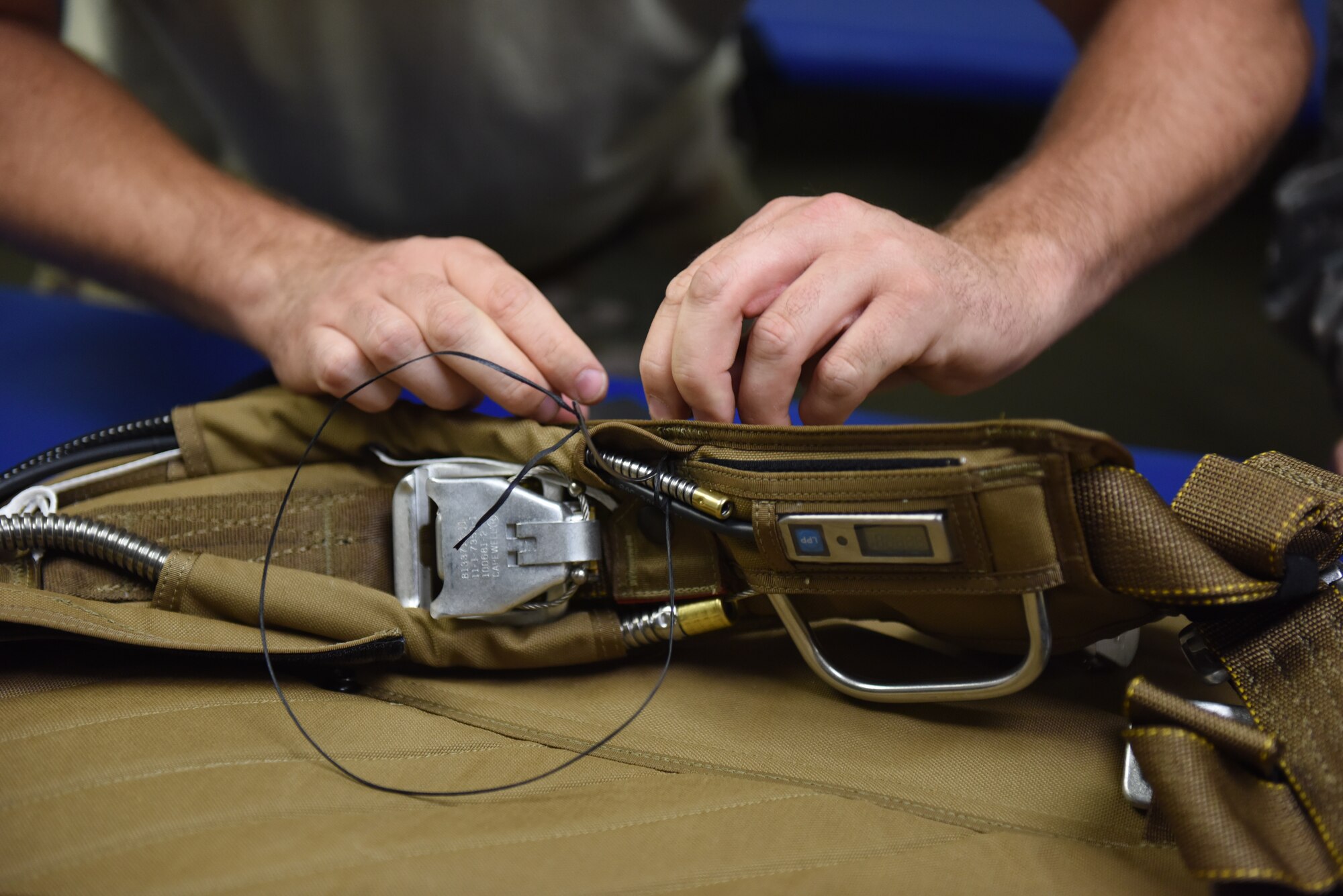 Tech. Sgt. Kurt Mellott, an aircrew flight equipment technician with the 193rd Special Operations Support Squadron, Middletown, Pennsylvania, Pennsylvania Air National Guard, builds a Low-Profile Parachute from scratch Aug. 9, 2018. The new parachutes replaced the old ones, which were originally constructed in the 1980’s. (U.S. Air National Guard photo by Senior Airman Julia Sorber/Released)