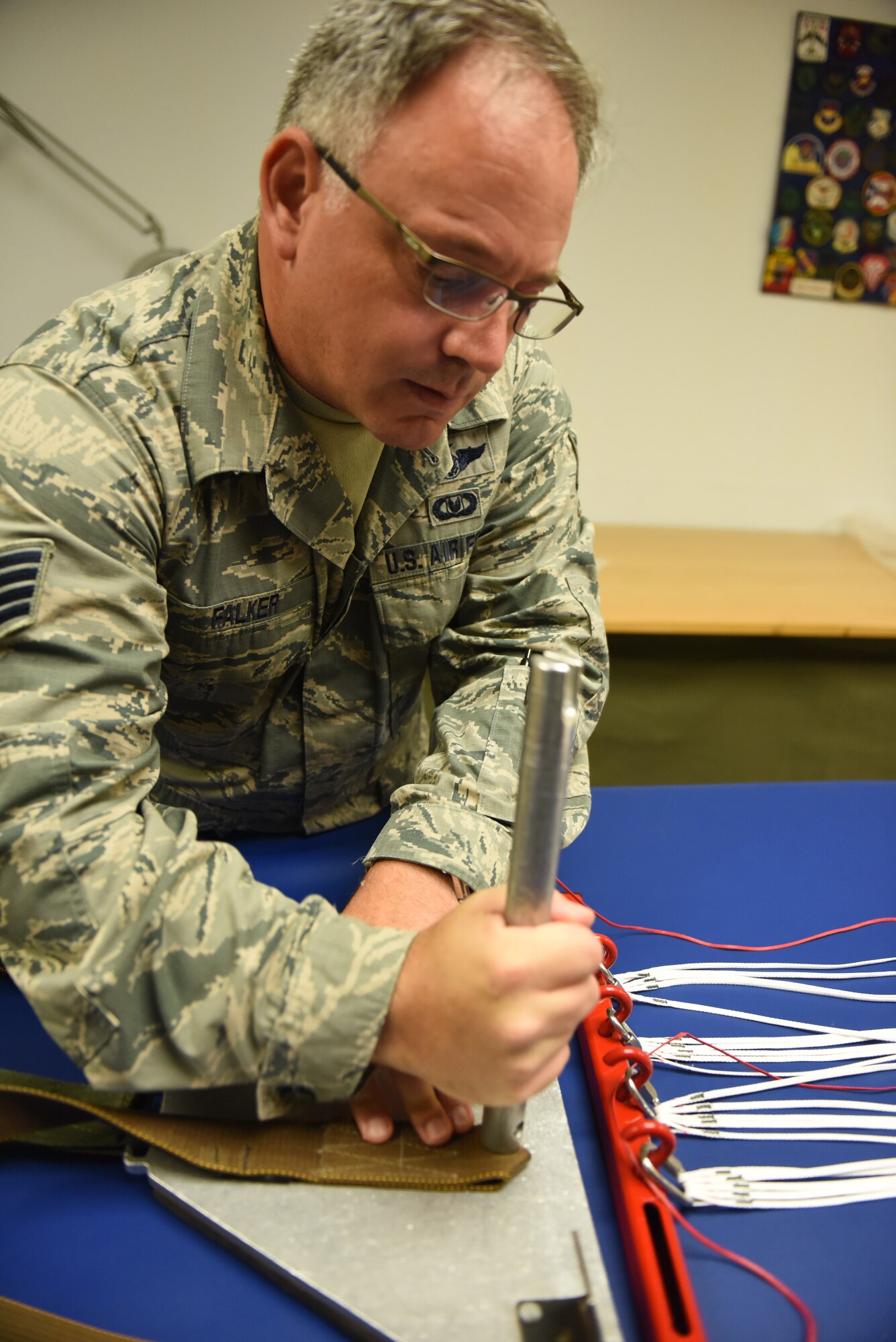 Staff Sgt. Stephen Falker, an aircrew flight equipment technicians with the 193rd Special Operations Support Squadron, Middletown, Pennsylvania, Pennsylvania Air National Guard, builds a Low-Profile Parachute from scratch Aug. 9, 2018. The new parachutes replaced the old ones, which were originally constructed in the 1980’s. (U.S. Air National Guard photo by Senior Airman Julia Sorber/Released)