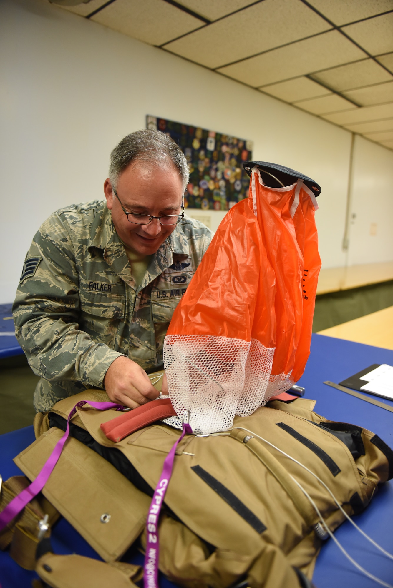 Staff Sgt. Stephen Falker, an aircrew flight equipment technicians with the 193rd Special Operations Support Squadron, Middletown, Pennsylvania, Pennsylvania Air National Guard, builds a Low-Profile Parachute from scratch Aug. 9, 2018. The new parachutes replaced the old ones, which were originally constructed in the 1980’s. (U.S. Air National Guard photo by Senior Airman Julia Sorber/Released)
