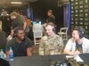 Soldier and gamers conducting an interview for Twitch TV