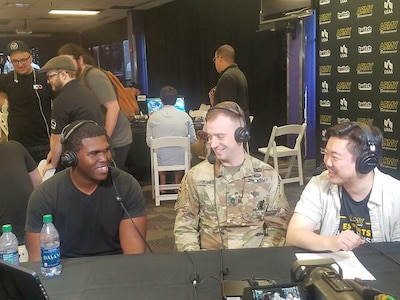 Soldier and gamers conducting an interview for Twitch TV
