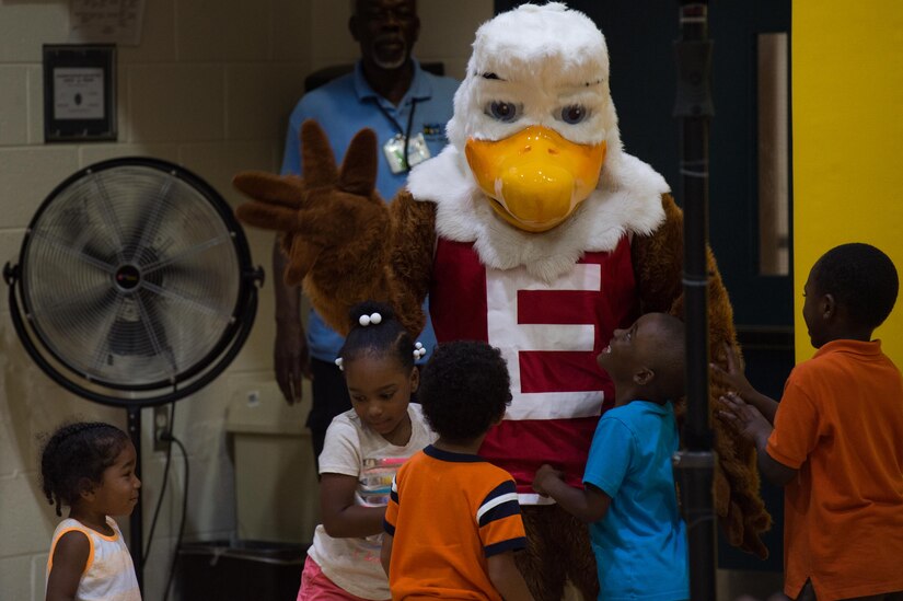 Eddie the Eagle greets children during the Army Community Service block party at Gen. Stanford Elementary School on Joint Base Langley-Eustis, Virginia, Aug. 9, 2018.