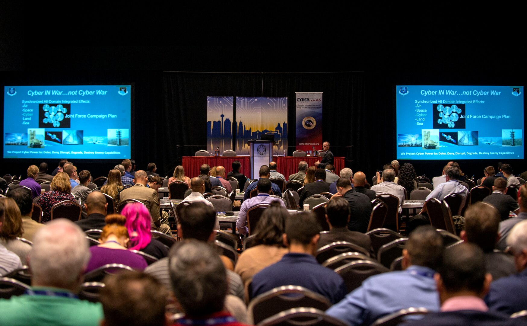 Robert Cole, Air Forces Cyber executive director, speaks to attendees at the CyberTexas Conference in San Antonio, Texas, Aug. 14, 2018. The conference was hosted to develop the next generations of cyber professionals. (U.S. Air Force photo by Tech. Sgt. R.J. Biermann)