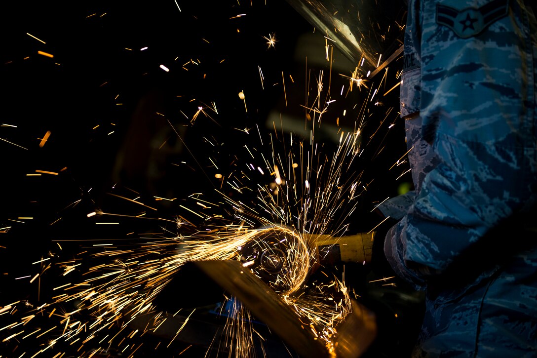 Airman 1st Class Jared King, 23d Civil Engineer Squadron (CES) water and fuel system maintenance apprentice, saws a structural support beam during the “A Day In A Life” program, Aug. 6, 2018, at Moody Air Force Base, Ga. The program challenges participating civil engineers to go behind-the-scenes to perform multiple jobs to better understand their fellow Airmen and better develop operational leaders. The structure shop from the 23d CES maintains the vertical structural integrity of all the facilities on base through painting, locksmithing, welding, metal fabricating and woodworking, along with preventative maintenance on roofs, doors and gates. (U.S. Air Force photo by Airman 1st Class Erick Requadt)