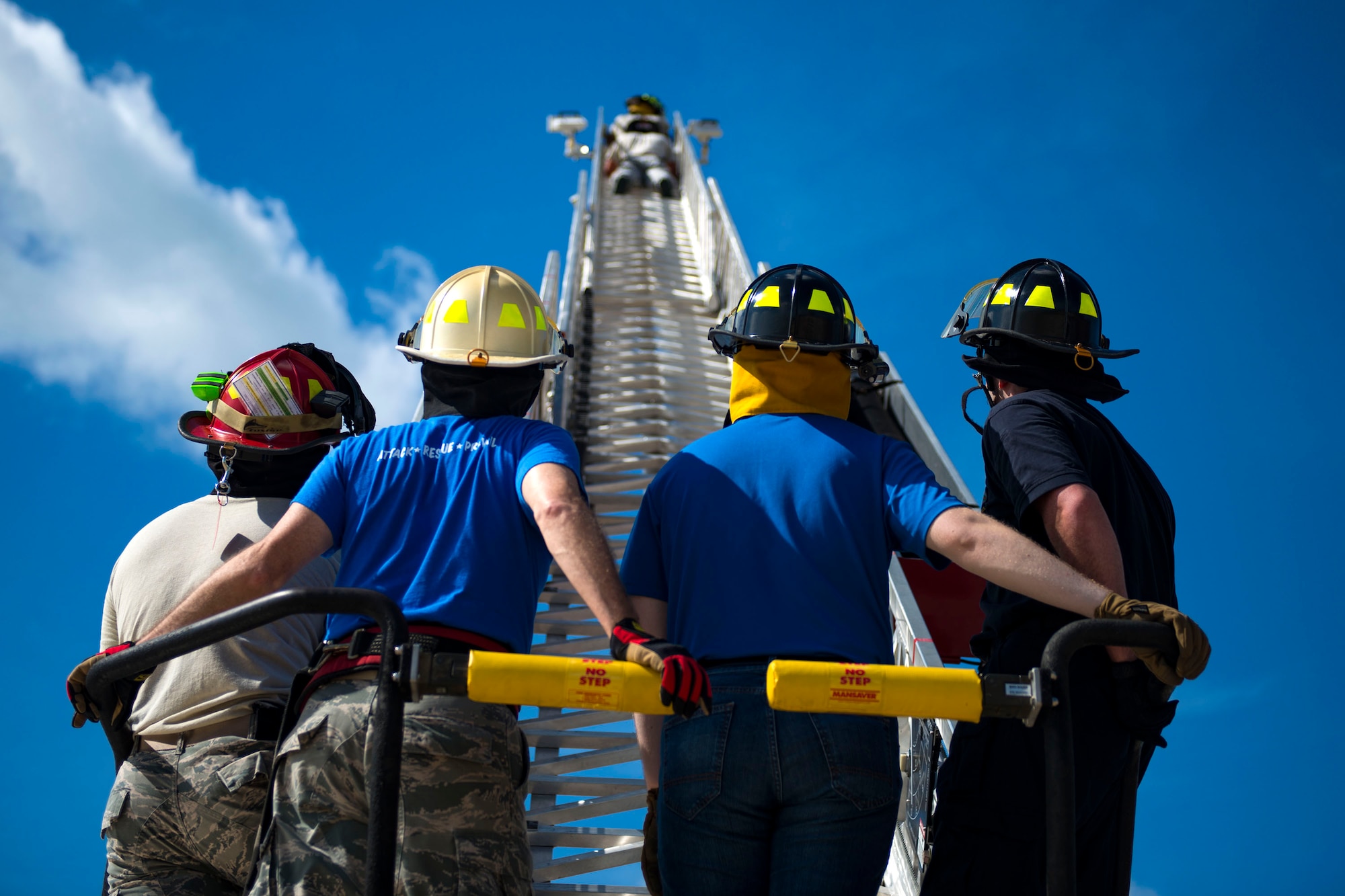 Airmen from the 23d Civil Engineer Squadron (CES) watch as a participant takes part in ladder operations during the “A Day In A Life” program, Aug. 10, 2018, at Moody Air Force Base, Ga. The program challenges participating civil engineers to go behind-the-scenes to perform multiple jobs to better understand their fellow Airmen and better develop operational leaders. The firefighters from the 23d CES train daily through their multifaceted capabilities in fire prevention to ensure they are proficient in their duties to keep Moody safe. (U.S. Air Force photo by Airman 1st Class Erick Requadt)