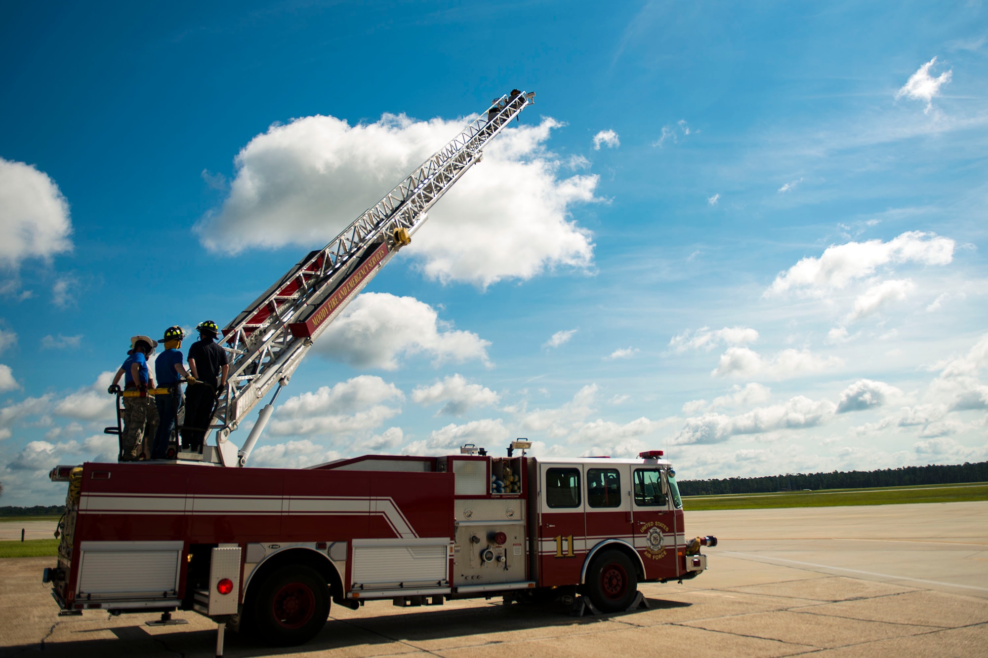 Airmen from the 23d Civil Engineer Squadron (CES) participate in ladder operations during the “A Day In A Life” program, Aug. 10, 2018, at Moody Air Force Base, Ga. The program challenges participating civil engineers to go behind-the-scenes to perform multiple jobs to better understand their fellow Airmen and better develop operational leaders. The firefighters from the 23d CES train daily through their multifaceted capabilities in fire prevention to ensure they are proficient in their duties to keep Moody safe. (U.S. Air Force photo by Airman 1st Class Erick Requadt)