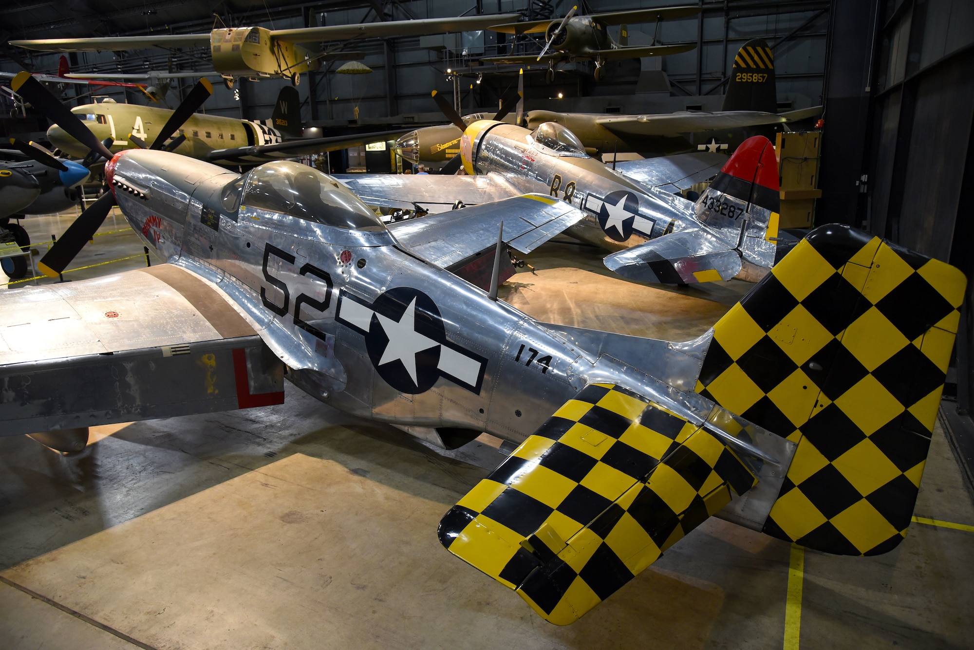 View of the North American P-51D Mustang and the Republic P-47D (Bubble Canopy Version) in the WWII Gallery at the National Museum of the U.S. Air Force. (U.S. Air Force photo by Ken LaRock)