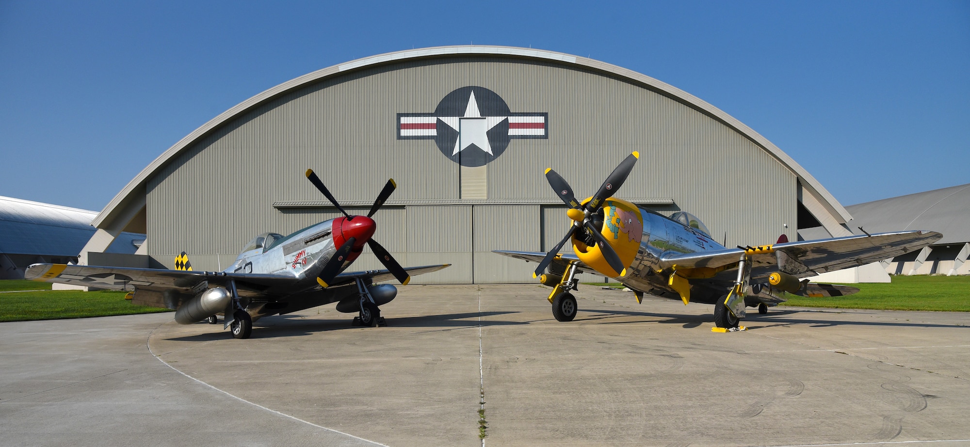 A view of the North American P-51D Mustang and the Republic P-47D (Bubble Canopy Version) before restoration crews at the National Museum of the U.S. Air Force moved the aircraft into the WWII Gallery on Aug. 14, 2018. Several WWII era aircraft on display were temporarily placed throughout the museum to provide adequate space for the Memphis Belle exhibit opening events. (U.S. Air Force photo by Ken LaRock)