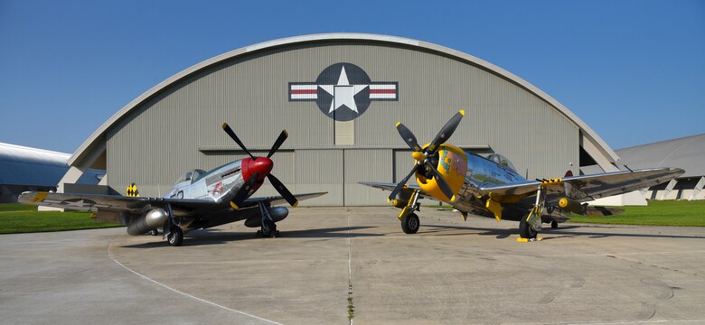 A view of the North American P-51D Mustang and the Republic P-47D (Bubble Canopy Version) before restoration crews at the National Museum of the U.S. Air Force moved the aircraft into the WWII Gallery on Aug. 14, 2018. Several WWII era aircraft on display were temporarily placed throughout the museum to provide adequate space for the Memphis Belle exhibit opening events. (U.S. Air Force photo by Ken LaRock)