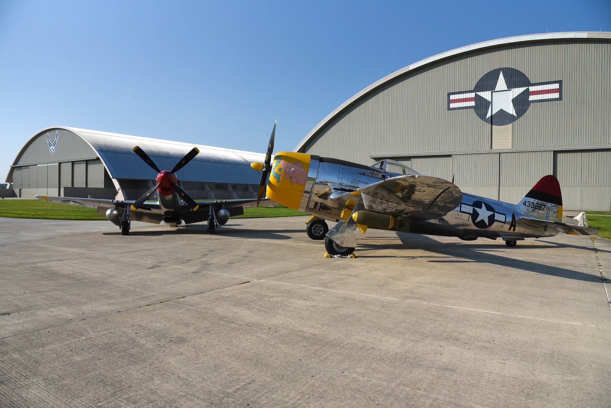 A view of the North American P-51D Mustang and the Republic P-47D (Bubble Canopy Version) before restoration crews at the National Museum of the U.S. Air Force moved the aircraft into the WWII Gallery on Aug. 14, 2018. Several WWII era aircraft on display were temporarily placed throughout the museum to provide adequate space for the Memphis Belle exhibit opening events. (U.S. Air Force photo by Ken LaRock)