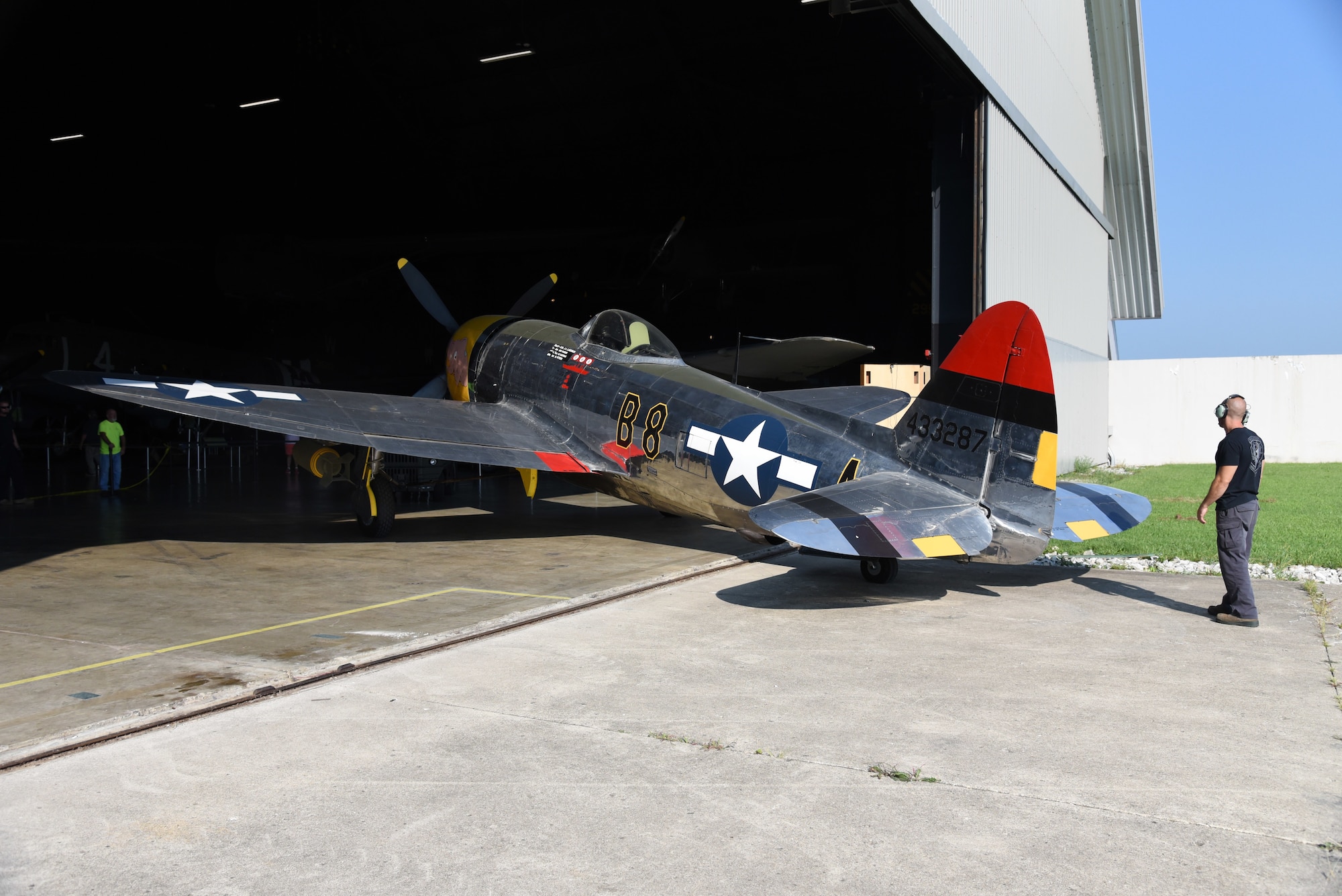 Museum restoration crews move the Republic P-47D (Bubble Canopy Version) back into the WWII Gallery at the National Museum of the U.S. Air Force on Aug. 14, 2018. Several WWII era aircraft were temporarily placed throughout the museum to provide adequate space for the Memphis Belle exhibit opening events. (U.S. Air Force photo by Ken LaRock)