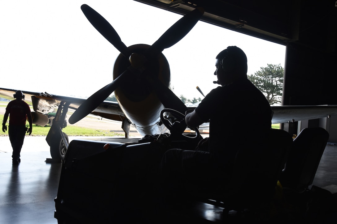 Museum restoration crews move the Republic P-47D (Bubble Canopy Version) back into the WWII Gallery at the National Museum of the U.S. Air Force on Aug. 14, 2018. Several WWII era aircraft were temporarily placed throughout the museum to provide adequate space for the Memphis Belle exhibit opening events. (U.S. Air Force photo by Ken LaRock)