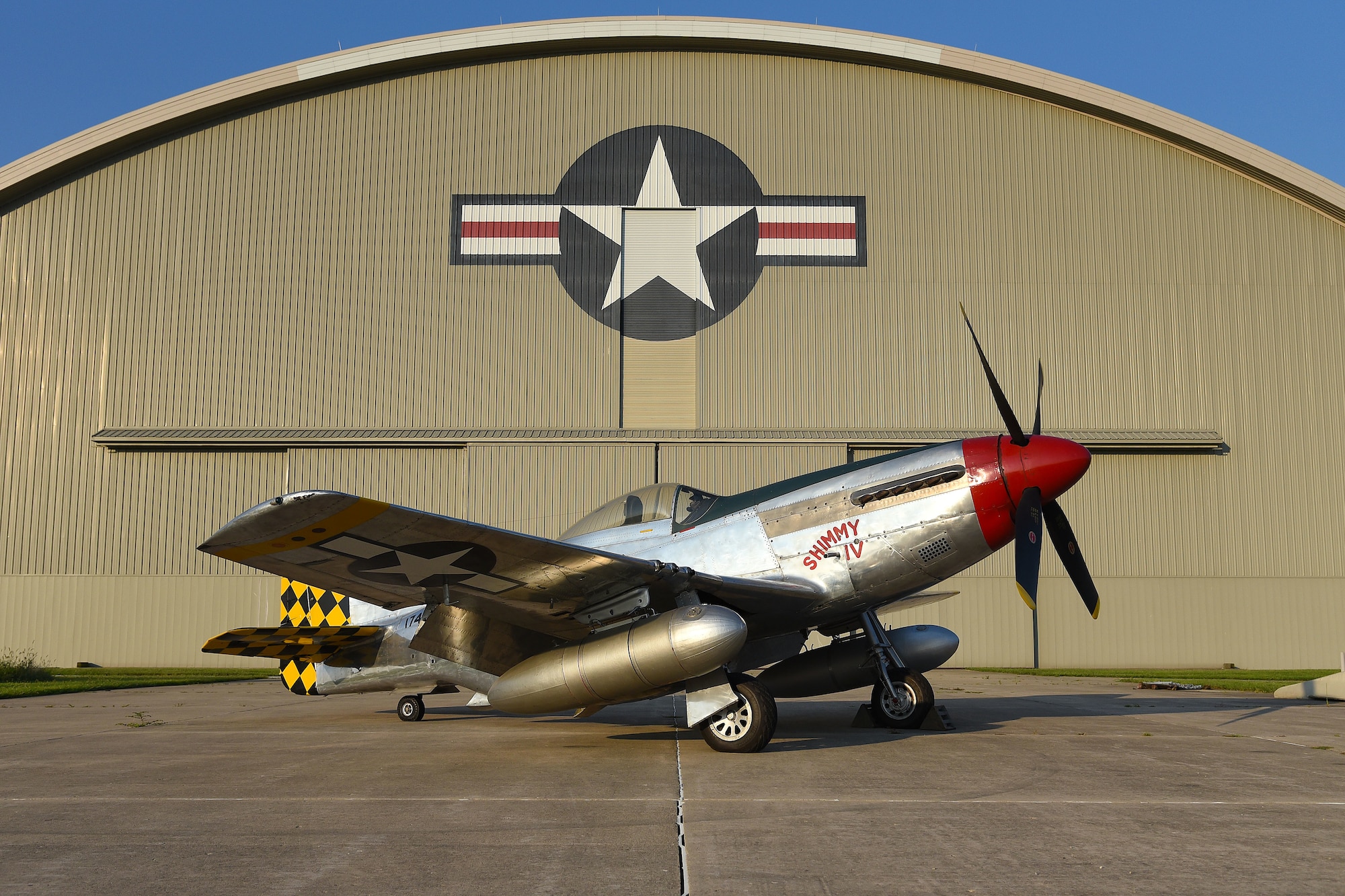 A view of the North American P-51D Mustang before restoration crews at the National Museum of the U.S. Air Force moved the aircraft into the WWII Gallery on Aug. 14, 2018. Several WWII era aircraft on display were temporarily placed throughout the museum to provide adequate space for the Memphis Belle exhibit opening events. (U.S. Air Force photo by Ken LaRock)