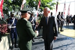 Defense Secretary James N. Mattis shakes hands with a Brazilian defense official.