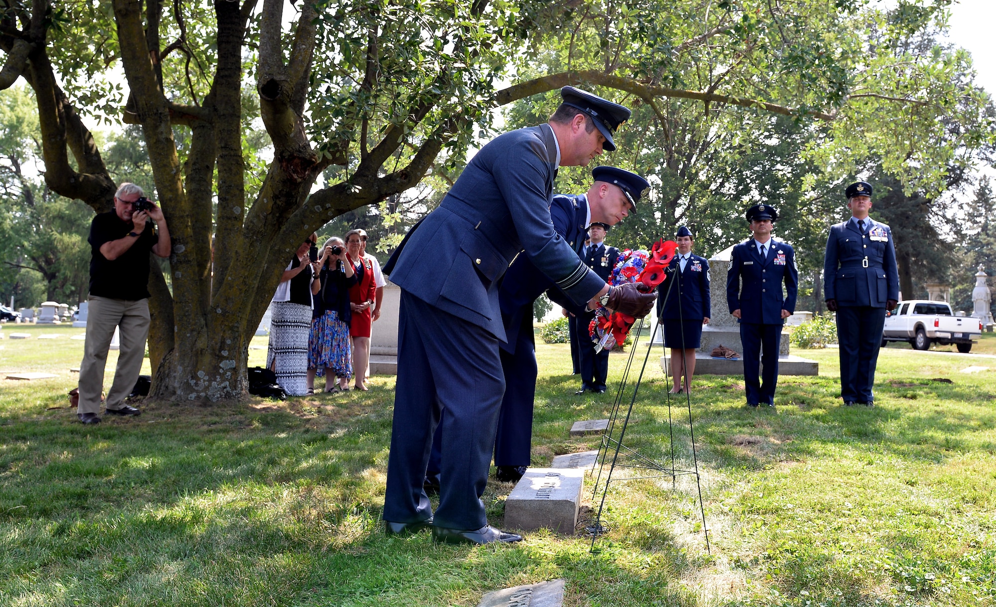 From left to right, 56 Squadron Leader David Hockley and 55th Wing Commander Col. Michael Manion place their respective country’s wreaths on the gravesite of Lt. Jarvis Offutt at Forest Lawn Cemetery in Omaha, Nebraska Aug. 13, 2018. A ceremony was held during the 2018 Offutt Air Force Base air and space show to honor Offutt who the base is named after. Offutt was the first Omaha native to die in WWI when his plane was shot down over France 100 years ago while serving in the 56 Squadron. (U.S. Air Force photo by Josh Plueger)